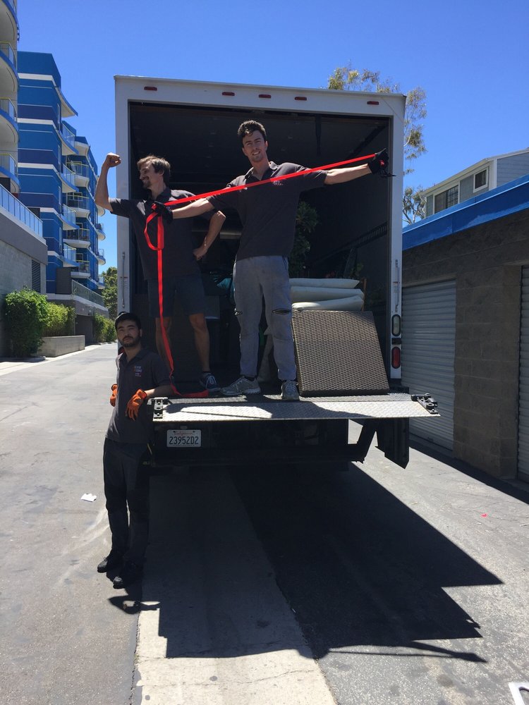 Professional moving service in front of suburban Brentwood home