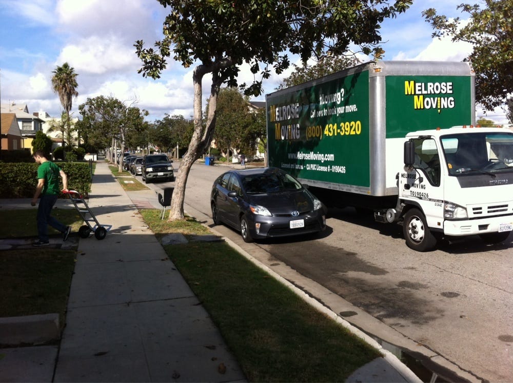Professional local movers unloading a truck in Brentwood, CA