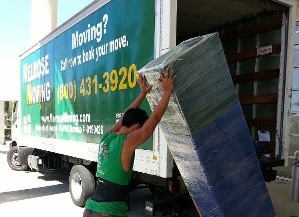 Moving boxes and furniture on sidewalk during Hollywood move