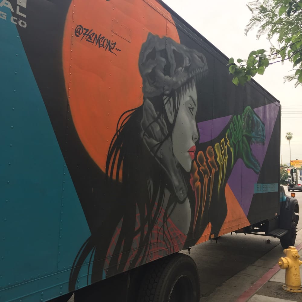 Professional movers loading boxes in East Los Angeles, CA home