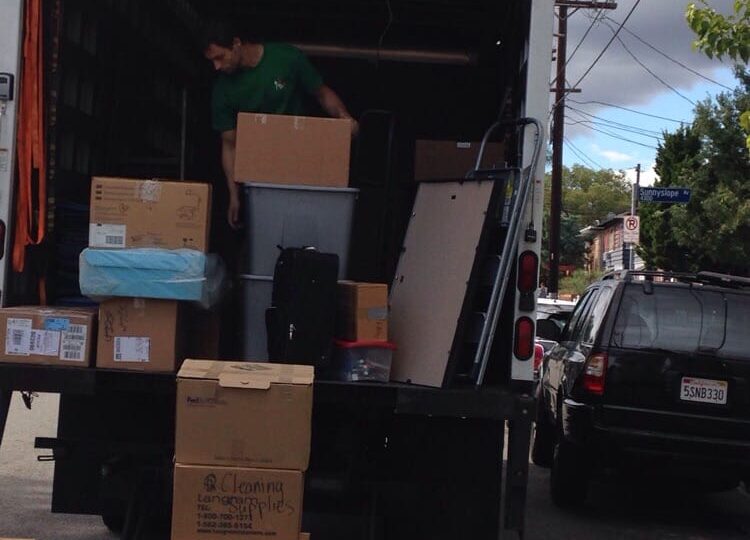 Melrose Moving crew carefully transporting furniture during Brentwood move