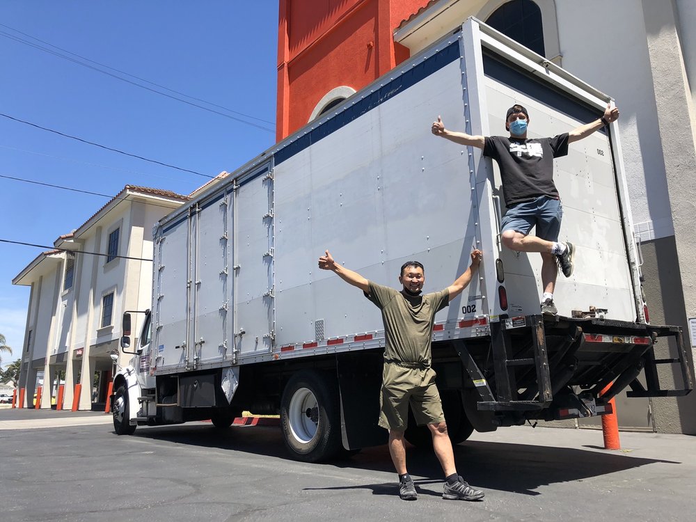 Professional movers loading boxes in East Los Angeles, CA home